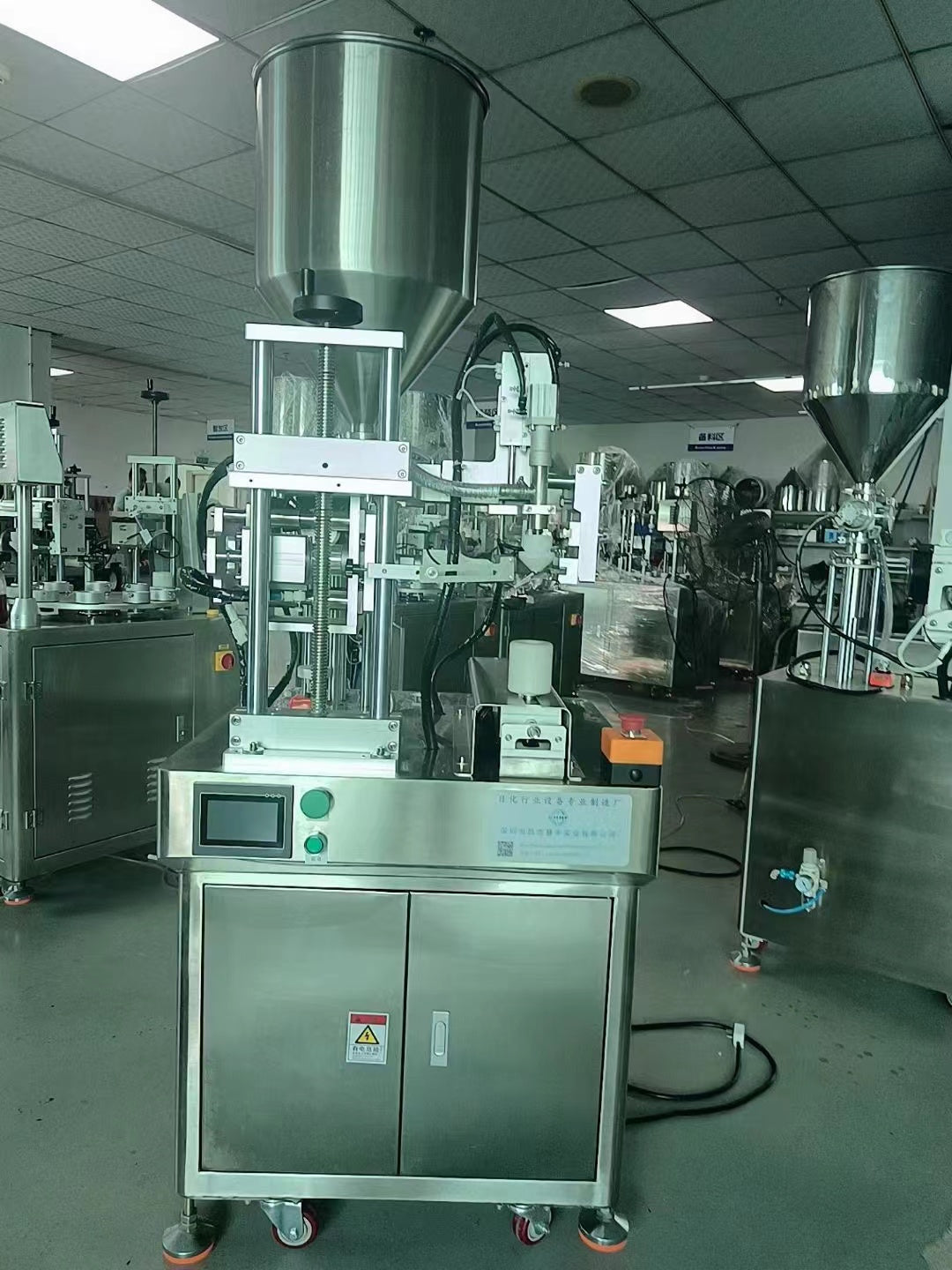Single tube filling and sealing machine
